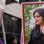 A protester holds a picture of Mahsa Amini during protests in Turkey last month