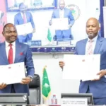 UBA Group DMD Muyiwa Akinyemi and Secretary-General of the AfCFTA Secretariat, H.E. Wamkele Mene showing the signed MoU