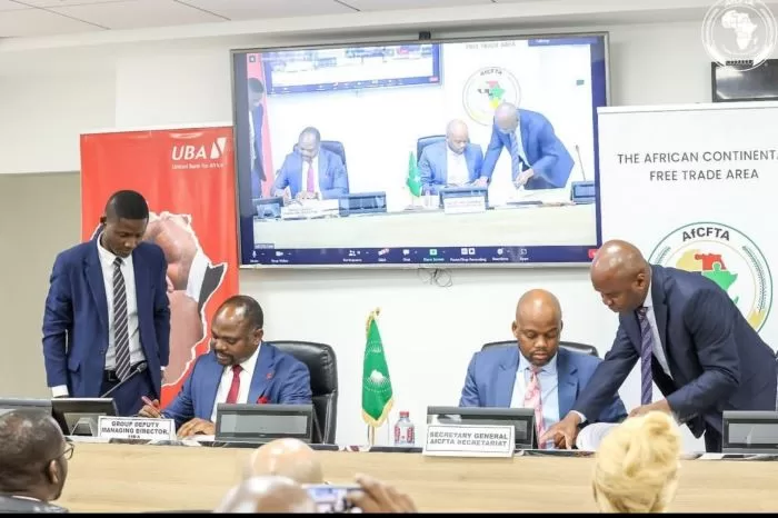 UBA Group DMD Muyiwa Akinyemi and Secretary-General of the AfCFTA Secretariat, H.E. Wamkele Mene signing the MoU